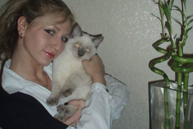 Anna Fermanova and a cat and some bamboo
